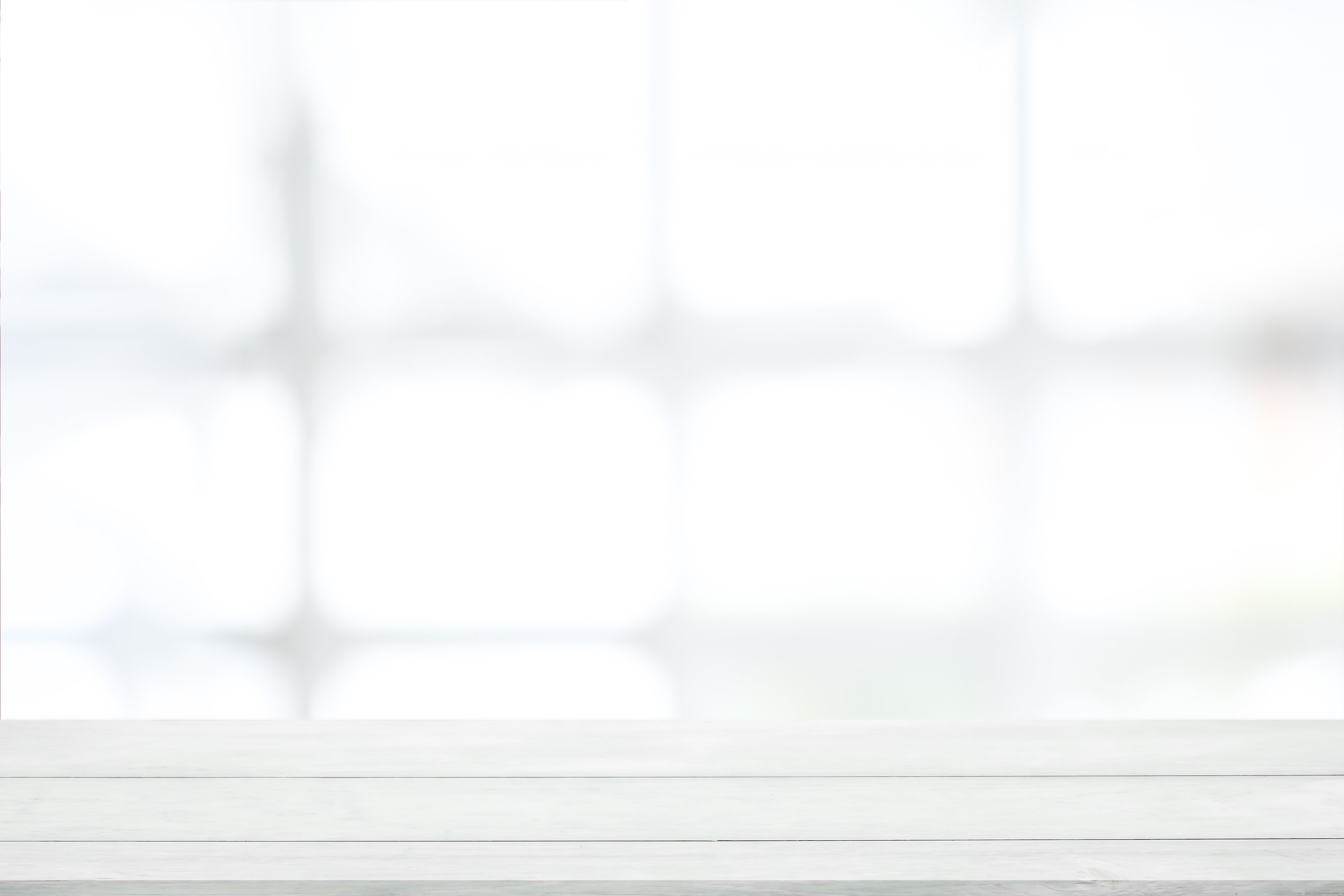 Empty White Wooden Table with Blurred Background